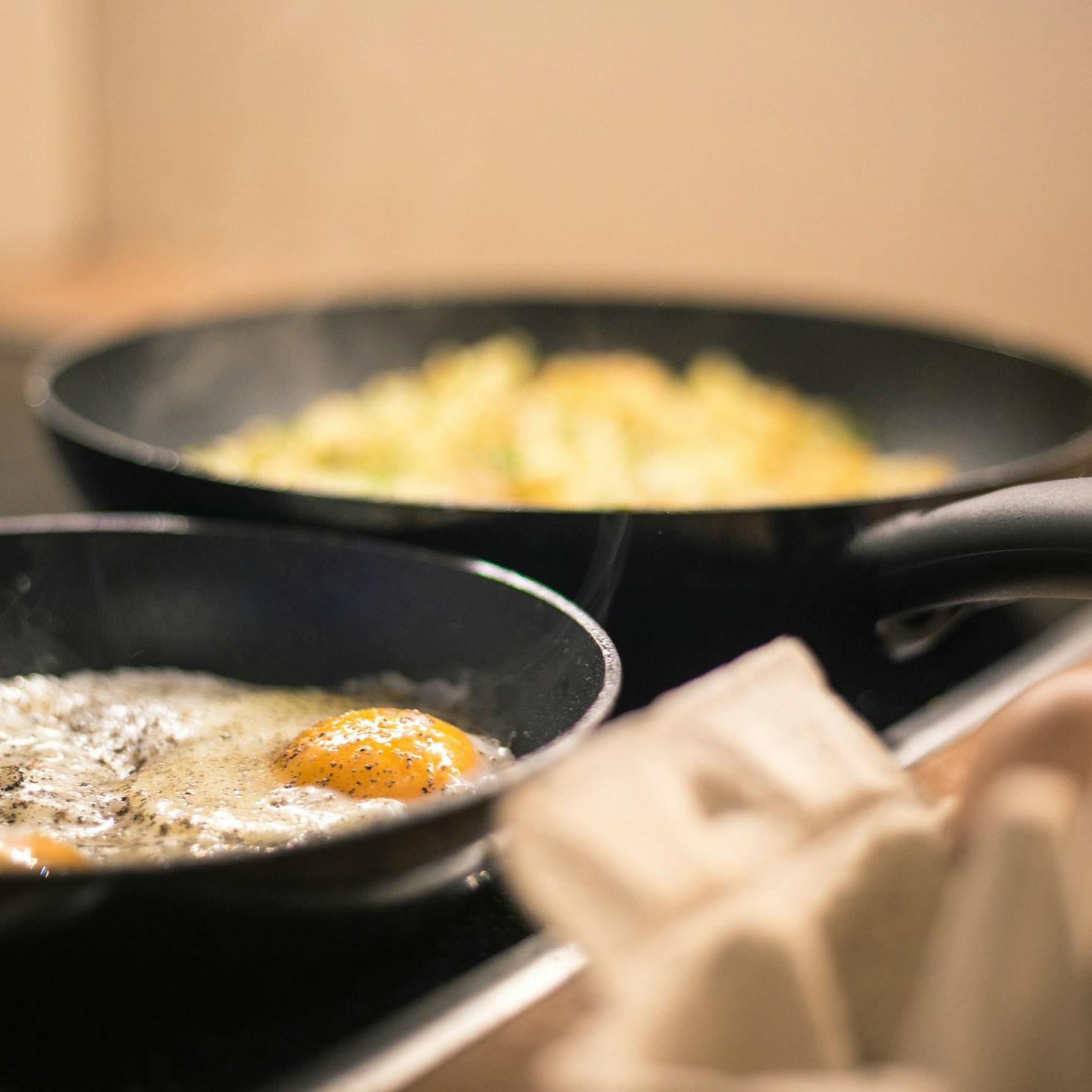 Diverse group of community members sharing a meal together, highlighting the connections built through collaborative cooking